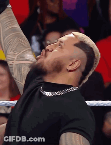 Man With Shaved Head And Chain GIF