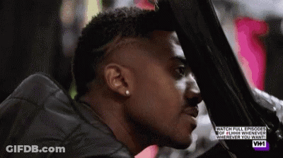 Man With Shaved Head Looking Out Car Window GIF