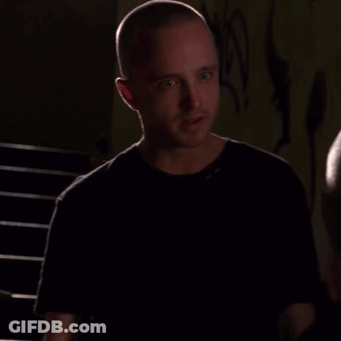Man With Shaved Head Talking To Another Man GIF