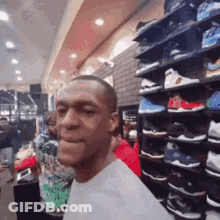Man With Shoe Shelf In Shoe Store GIF