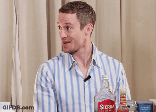 Man With Sierra Tequila Bottle Behind Him GIF