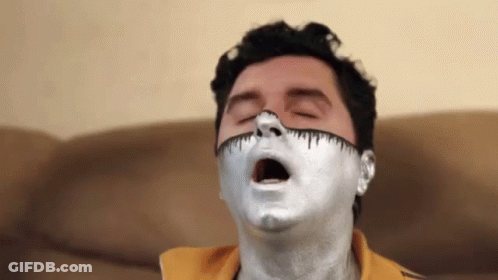 Man With Silver Paint On Face Eyes Closed GIF