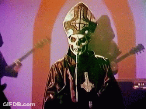Man With Skull Face Singing Into Microphone GIF