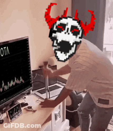 Man With Skull On Head Looking At Computer GIF