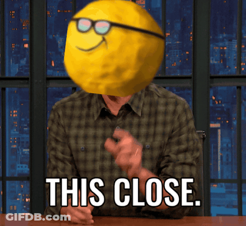 Man With Smiley Face On Head This Close GIF