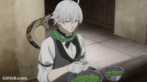 Man With Snake Around Neck Preparing Food GIF