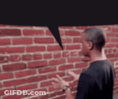 Man With Speech Bubble At Red Brick Wall GIF
