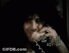 Man With Stack Of Money On Head Talking On Cell Phone GIF