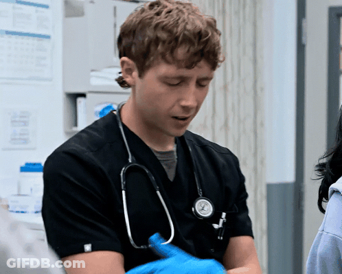 Man With Stethoscope In Black Scrub GIF