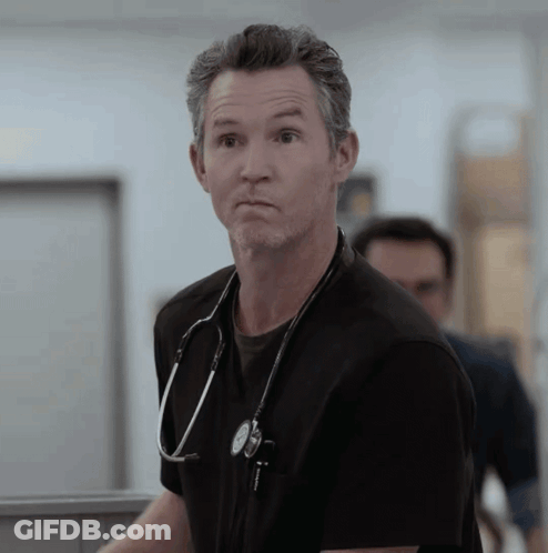 Man With Stethoscope Looking At Camera GIF