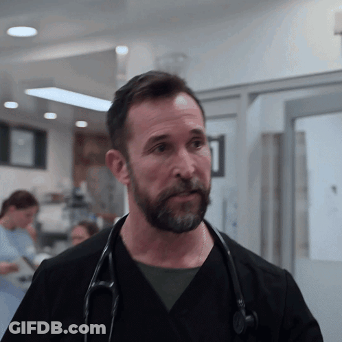 Man With Stethoscope Looking At Camera GIF