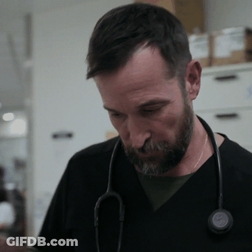 Man With Stethoscope Looking Down GIF