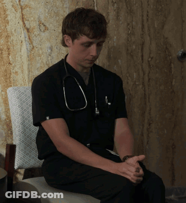 Man With Stethoscope Sitting Hands Folded GIF