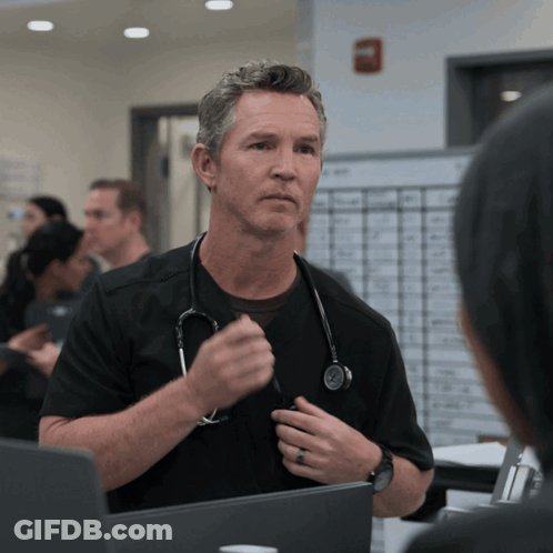 Man With Stethoscope Talking To Another Man GIF