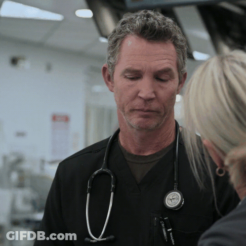 Man With Stethoscope Talking To Woman In Hospital GIF