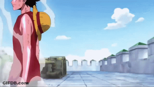 Man With Straw Hat Walking Down Sidewalk GIF