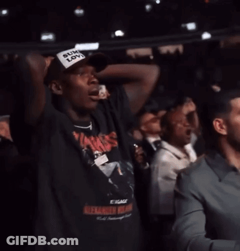 Man With Sum Love Hat Between Two Men GIF