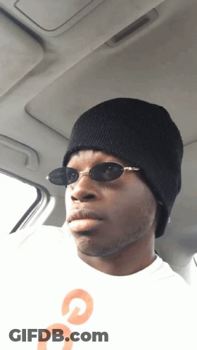 Man With Sunglasses And Beanie In Back Seat GIF