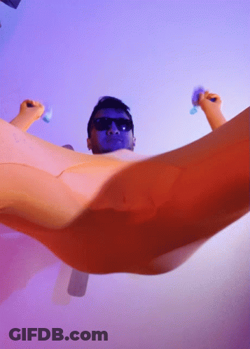 Man With Sunglasses And Blue Face Laying In Bathtub GIF