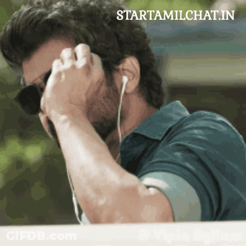 Man With Sunglasses And Earbuds On Phone Starttamilchat.in GIF
