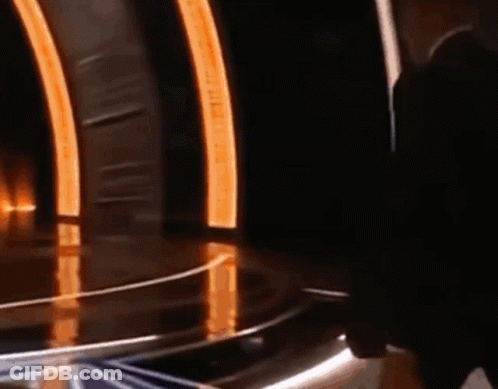 Man With Sunglasses And Headphones Mic In Front Of Crowd GIF