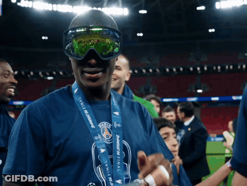 Man With Sunglasses And Medal Saying Paris GIF