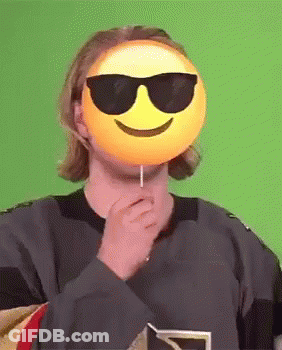 Man With Sunglasses And Smiley Mask Holding Lollipop GIF