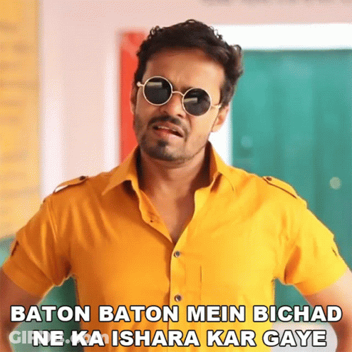 Man With Sunglasses Baton Baton Mein Bichad Ne Ka Ishara Kar Gaya GIF