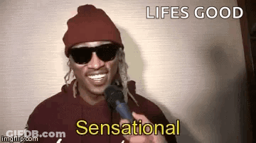 Man With Sunglasses Beanie Talking Microphone Lifes Good Sensational GIF