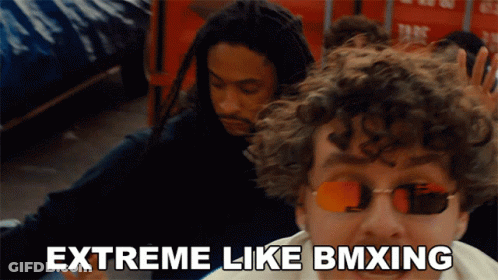 Man With Sunglasses Extreme Like BMXing Next To Another Man GIF