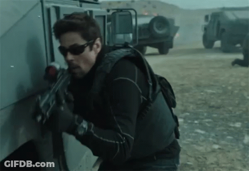 Man With Sunglasses Holding Gun GIF