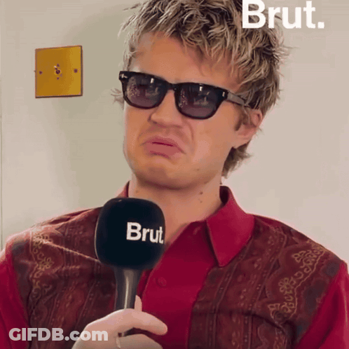 Man With Sunglasses Holding Microphone Saying Brut GIF