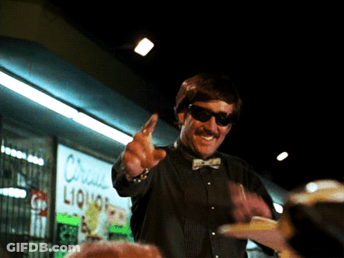 Man With Sunglasses In Front Of Liquor Store GIF