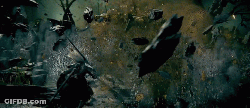 Man With Sword In Cemetery Surrounded By Zombies GIF
