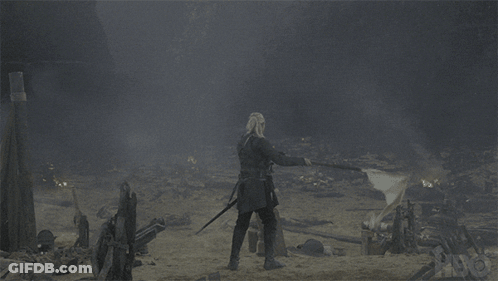 Man With Sword In Field With Flag GIF