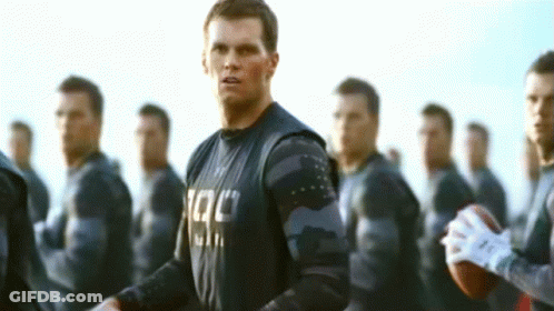 Man With Tac Shirt And Group Of Men GIF
