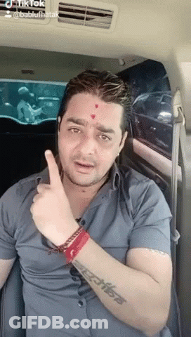 Man With Tattoo Giving Thumbs Up In Car GIF