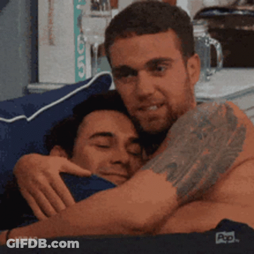 Man With Tattoo Hugging Another Man GIF