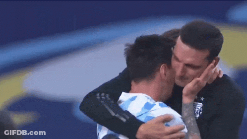 Man With Tattoo Hugging Soccer Player GIF