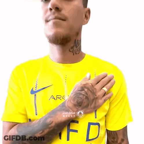 Man With Tattoo In Yellow Shirt With Letter F GIF