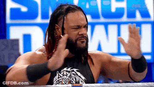Man With Tattoo Raising Arm GIF