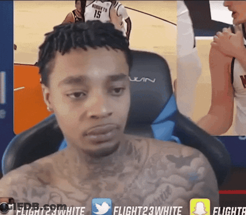 Man With Tattoo Sitting In Front Of Flight 23 White Screen GIF
