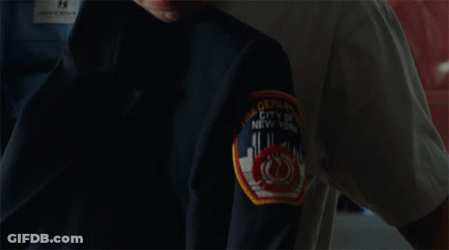 Man With Tattoo Smelling Black Jacket GIF