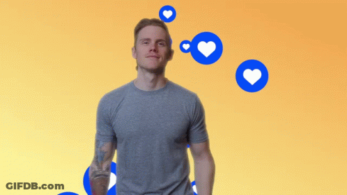 Man With Tattoo Surrounded By Blue Hearts GIF