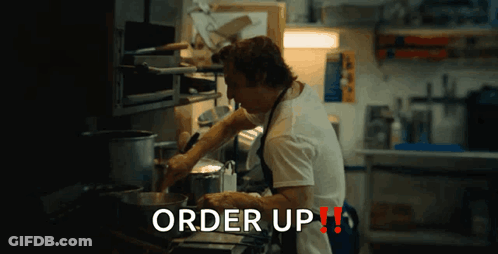 Man With Tattoo 'Zz' Wearing Apron GIF