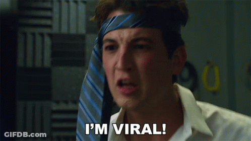 Man With Tie On Head Saying I'm Viral GIF