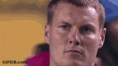 Man With Towel Around Neck Looking At Camera GIF