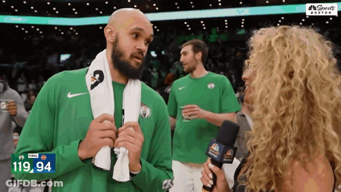 Man With Towel Interviewed By Woman With Microphone 119.94 GIF