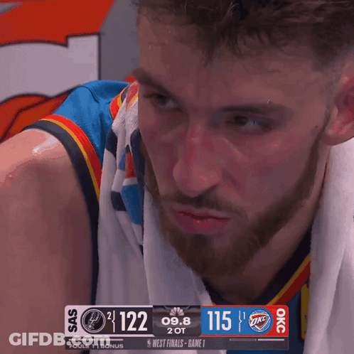 Man With Towel Looking At Scoreboard GIF