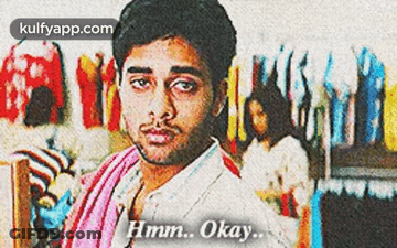 Man With Towel Says Hmm Okay In Front Of Clothes GIF